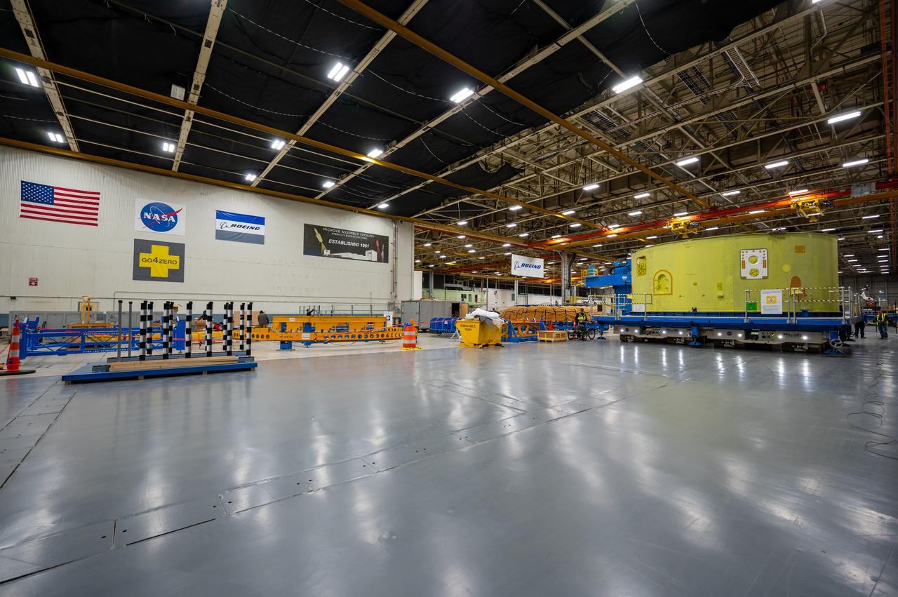 Crews at NASA’s Michoud Assembly Facility in New Orleans move the forward skirt of NASA’s Space Launch System (SLS) rocket to another part of the facility Dec. 15. Teams are preparing to apply the thermal protection system to the flight hardware, which will protect it from the extreme temperatures during launch and flight. The forward skirt is part of the core stage that will power the SLS rocket for the Artemis III mission. The forward skirt houses flight computers, cameras, and avionics.. The SLS core stage is made up of five unique elements: the forward skirt, liquid oxygen tank, intertank, liquid hydrogen tank, and the engine section. When fully stacked, the forward skirt is located at the top of the core stage and connects the stage to the upper part of the rocket.  Together with its four RS-25 engines, the rocket’s massive 212-foot-tall core stage — the largest stage NASA has ever built — and its twin solid rocket boosters produce 8.8 million pounds of thrust to send NASA’s Orion spacecraft, astronauts and supplies beyond Earth’s orbit to the Moon and, ultimately, Mars. Offering more payload mass, volume capability and energy to speed missions through space, the SLS rocket, along with NASA’s Gateway in lunar orbit, the Human Landing System, and Orion spacecraft, is part of NASA’s backbone for deep space exploration and the Artemis lunar program. No other rocket is capable of carrying astronauts in Orion around the Moon in a single mission.